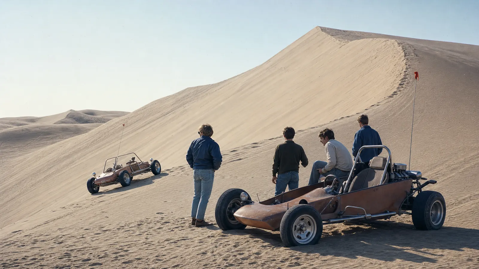 Historical reconstruction of early home-built dune buggies and riders at Glamis in the late 1960s