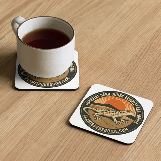 Cork-backed coasters with the Imperial Sand Dunes Fringe badge beside a mug
